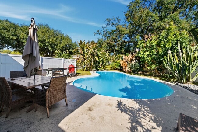 Building Photo - Charming Corner Lot Pool Home with Private Orchard Florida Living at Its Best – Pool, Privacy & P...