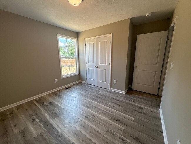 Building Photo - Charming New Home with a Rocking Chair Front Porch!