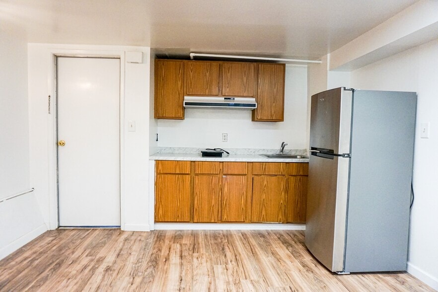 Kitchen with electric hot plate for simple home cooking, brand new fridge - 38 San Gabriel Ave