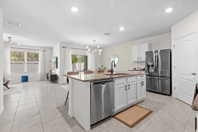 Building Photo - 4BR Under $2,300/mo | Tesla Charger | 15 Min to Lake Nona