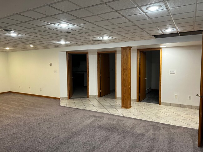 Basement with access to office, laundry, and second bathroom - 1120 Lealand Rd E