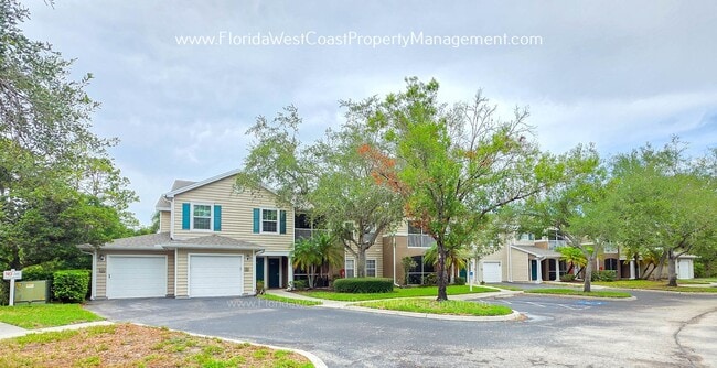 Building Photo - MOVE IN READY! LARGE 2 BEDROOM/2 BATH PLUS ATTACHED GARAGE! TILE/LVP THROUGHOUT!