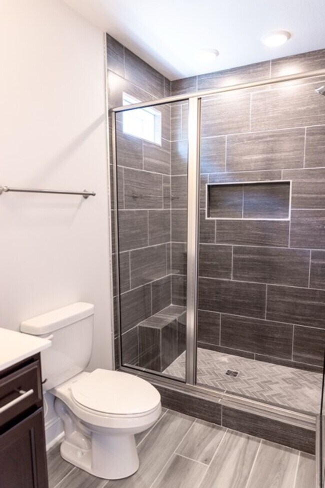 Building Photo - Modern Living Redefined with Stone Fireplace, Gray Cabinetry, Spa Inspired Primary Suite and Cove...