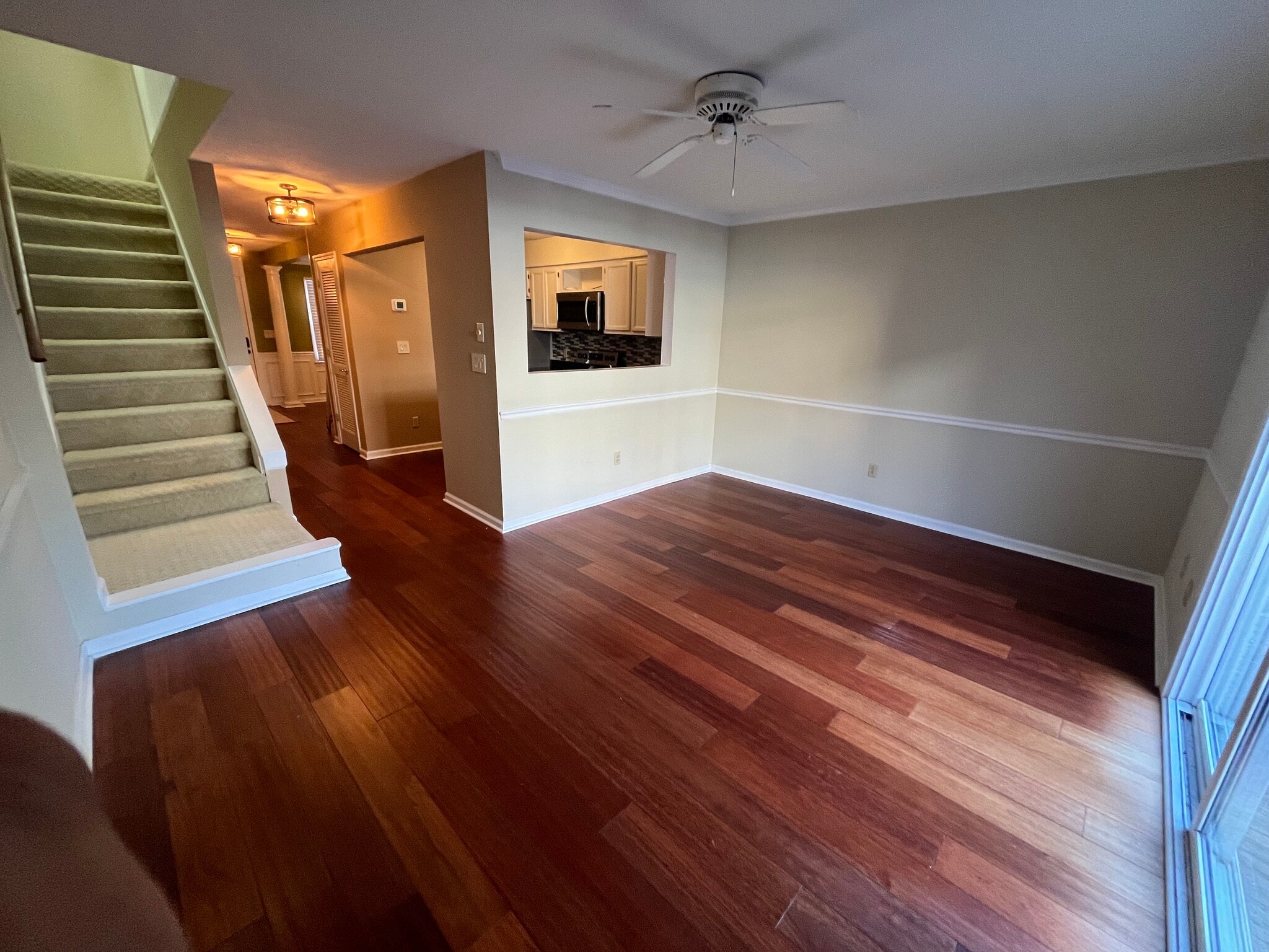 Living room features premium hardwood floor and easy stairs access - 830 44th Ave N