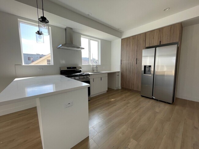 Building Photo - JUST COMPLETED MODERN TOWNHOMES! Never Liv...