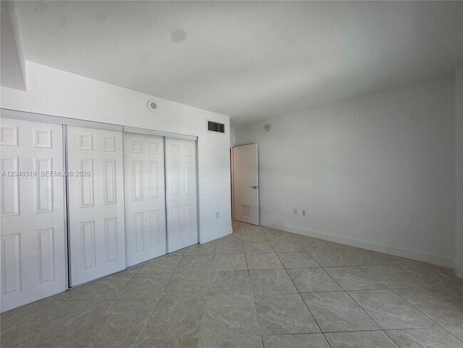 Building Photo - 10275 Collins Ave