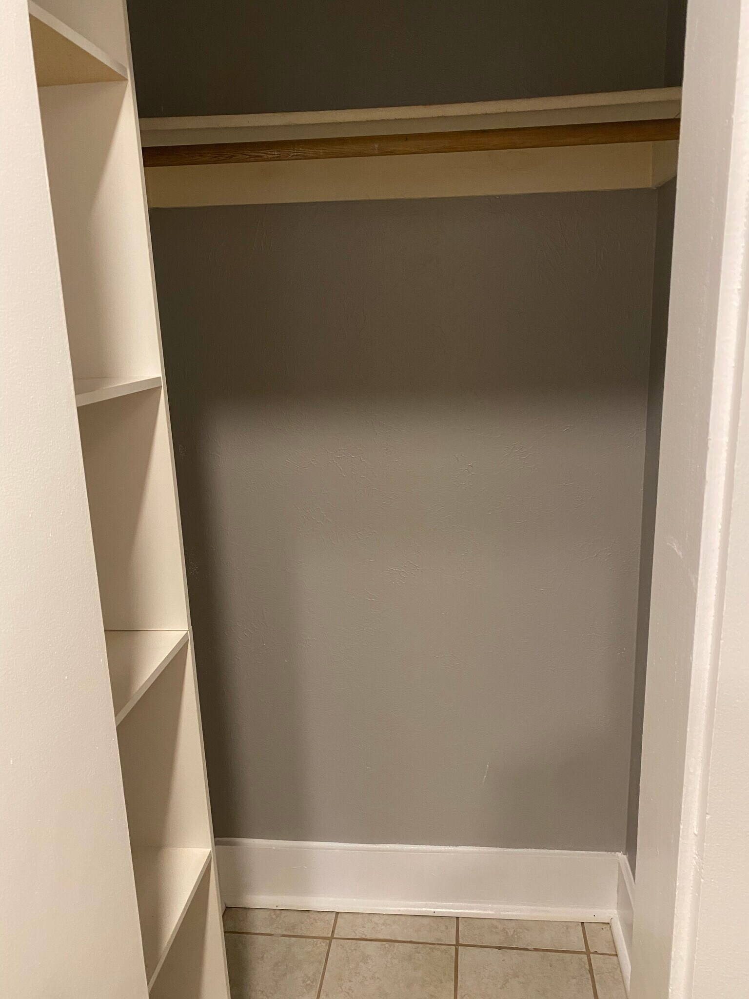 Closet with bar and shelves - 919 Massachusetts St