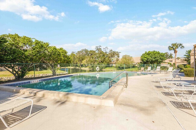 Building Photo - Beautiful Must See!! 3/2 Plus Sunroom & Garage!!  Gated Community!!