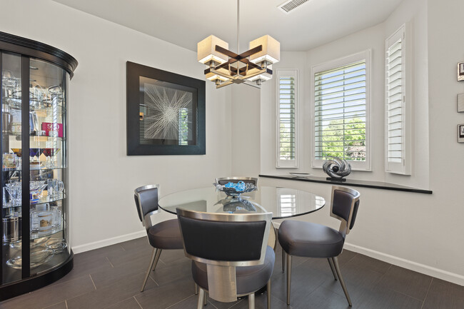 Dining area with bay window in back - 8935 E Phillips Dr