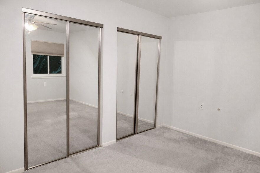 Mirrored double door two separate closets. - 10L Dennison Dr