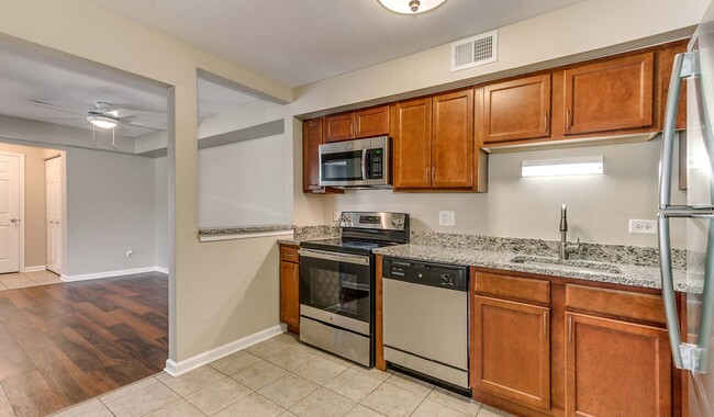 Spacious kitchen with stainless steel appliances and granite countertops - Willow Bend Apartments