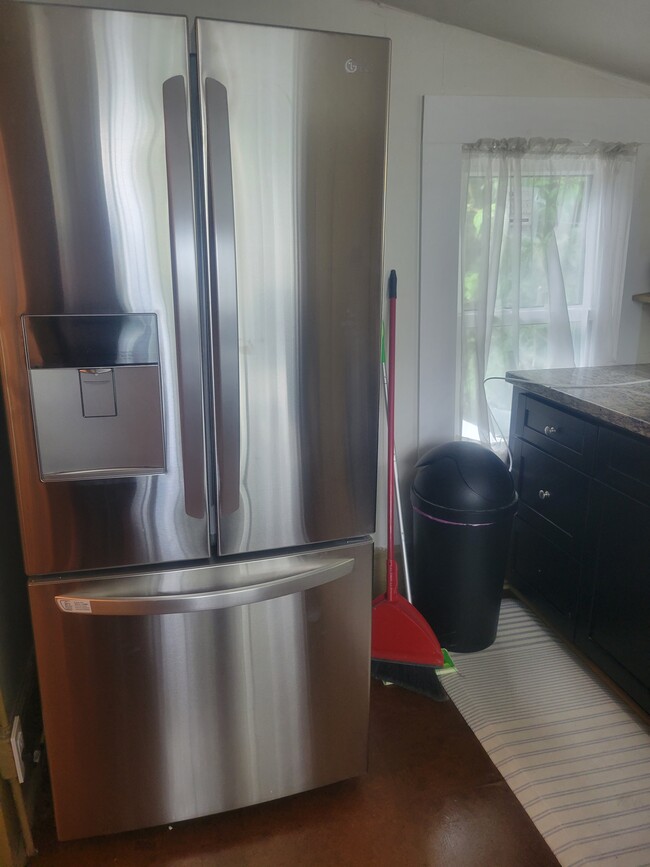 double door refrigerator with chilled water and ice cube dispenser in door - 3600 N Bay Homes Dr