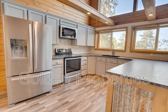 Building Photo - 11590 W Riverview Dr