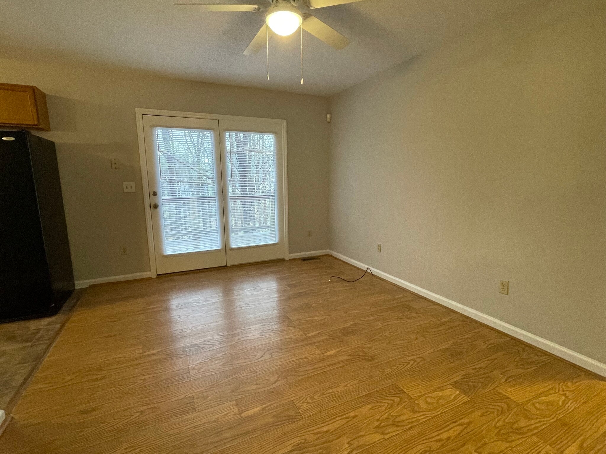 This view of the dining area shows the French door that leads to a deck - 4684 Coltsfoot Rd