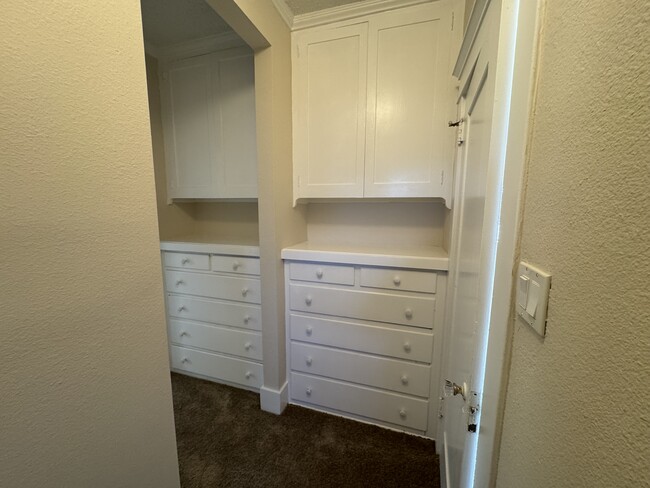 Hallway drawers and cabinets as viewed from the entrance to the hallway bathroom. - 1749 E 3rd St