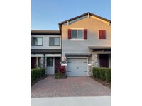 Building Photo - Nearly New Gated 3 Bedroom Townhouse with ...