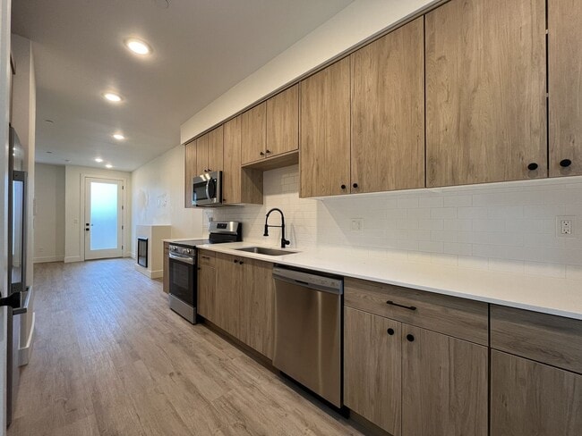 Building Photo - Modern 2-Bed, 1.5-Bath Condo with Custom Kitchen, Private Patio, and Prime Location