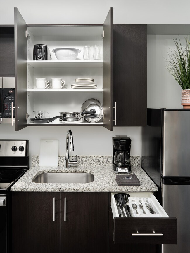 Cookware, dinnerware and utensils included - stayAPT Suites - Raleigh-Durham