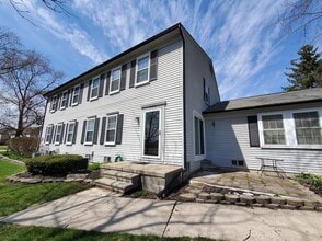 Building Photo - 2 Bedroom, 1.5 Bath Townhouse with Galley Kitchen & All Appliances, Open Living Area, Finished Ba...