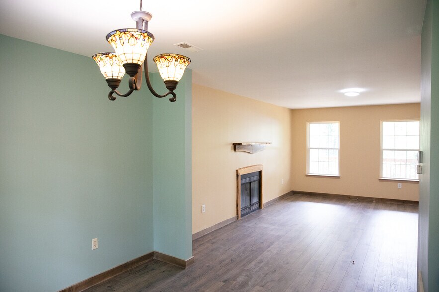 View from kitchen into dining and living room - 16 Townview Dr
