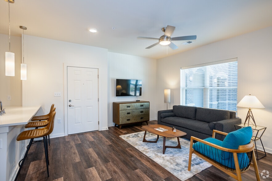 1BR, 1BA - 754SF - Living Room - Village at Thorncreek