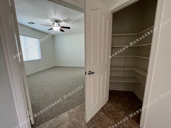 Building Photo - Well-Priced 3-Bedroom Plus Den in Gated Ru...