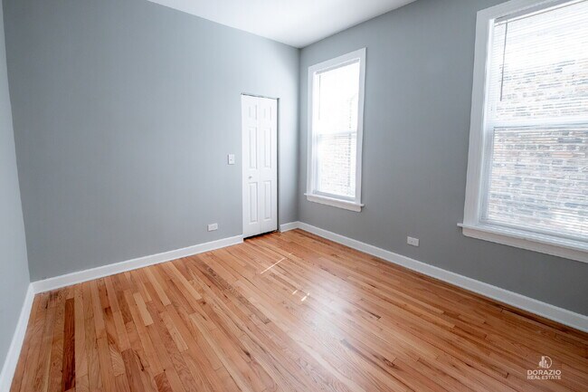 Building Photo - Modern 4BR Apartment with Hardwood Floors, Balcony & Central A/C