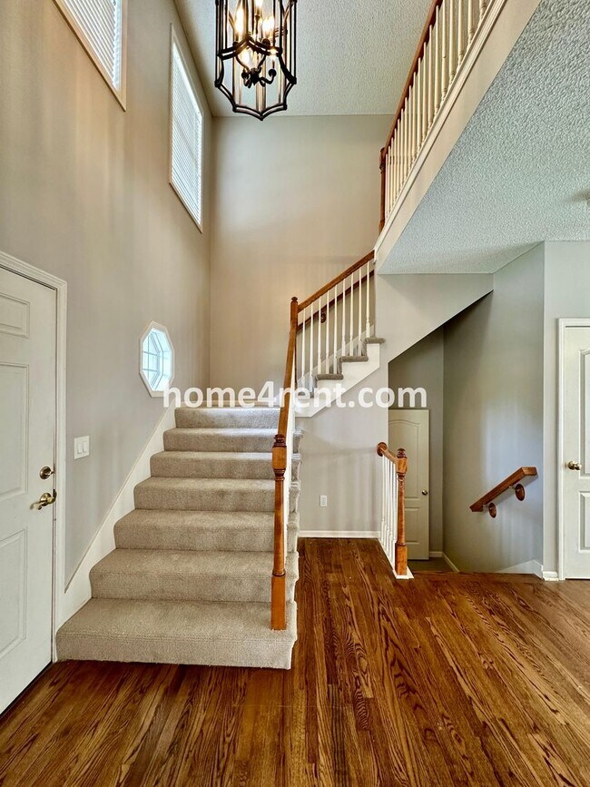 Building Photo - Beautiful Four-Bedroom Home with Three Car Garage, Wood Floors, Finished Basement and a Fenced Ya...