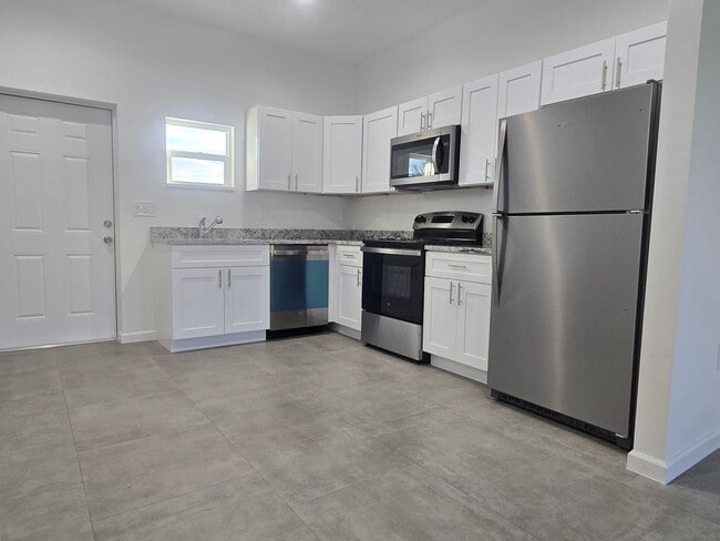 Building Photo - Brand-New 2/2/1 -SW Lehigh Acres-See this ...