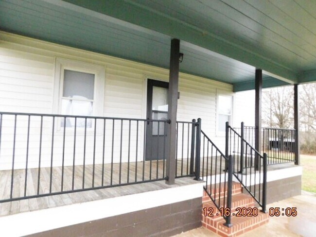 Building Photo - Home with 2 bedrooms, 1 bath, side deck, carport with side porch and detached garage