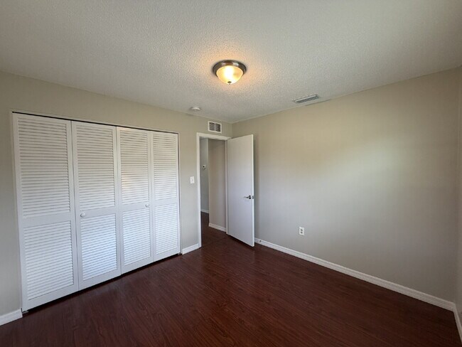 Building Photo - "Charming 3-Bedroom Home with Gleaming Hardwood Floors!"