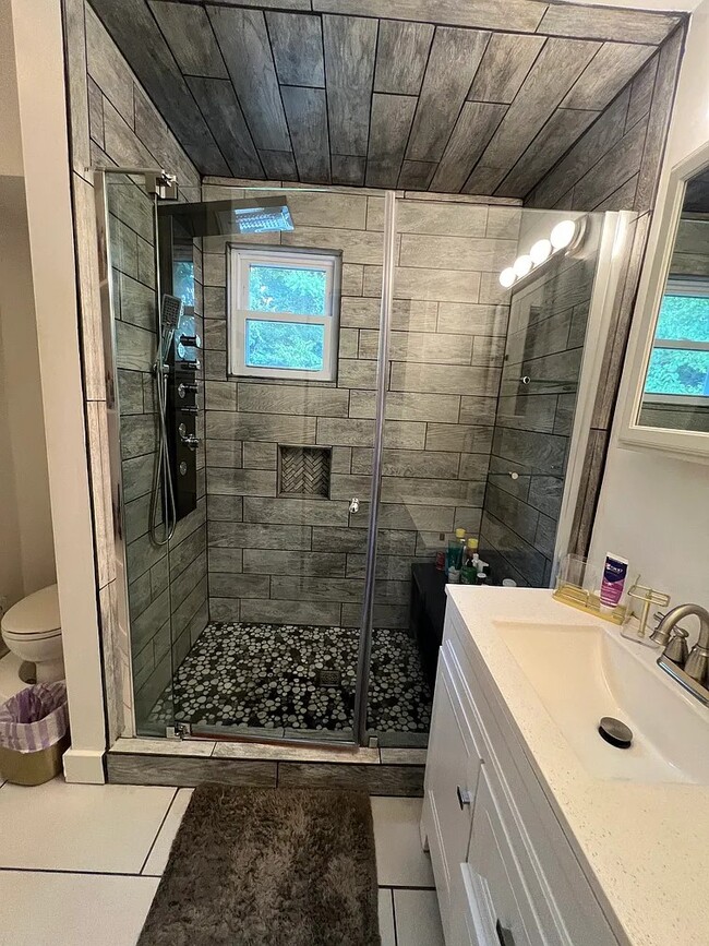 Bathroom has heated floors, multi jet shower panel, and shower bench - 116 Beam Way