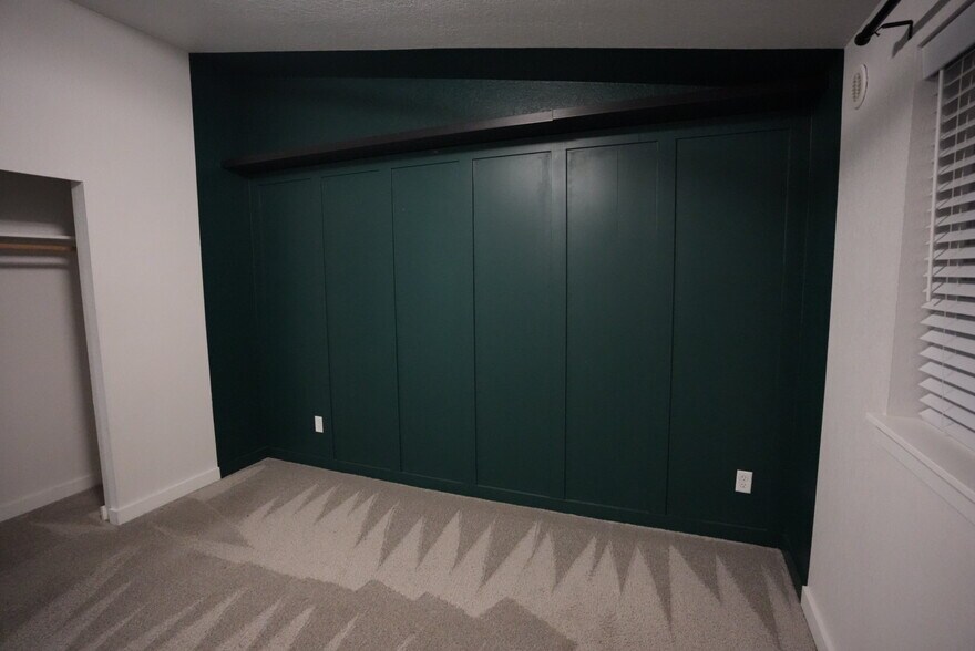 White walls with green accent and shelf - 23410 18th Ave S