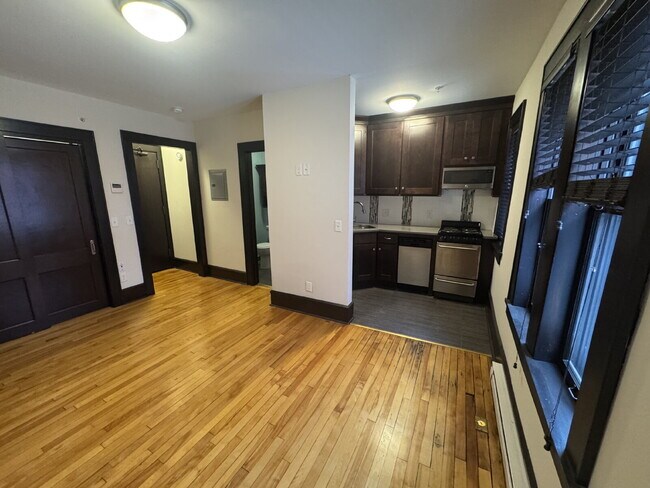 Building Photo - "Charming Studio Retreat with Hardwood Elegance in Downtown Minneapolis!"