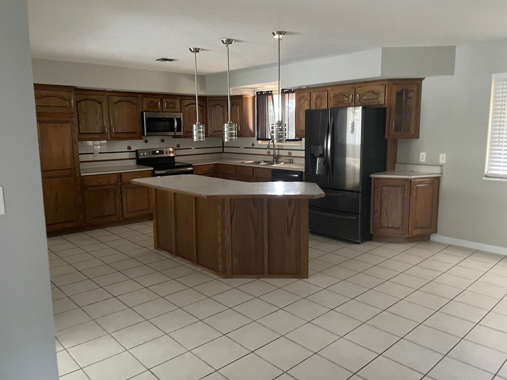 kitchen has island and newer applicances - 302 Coronation Dr