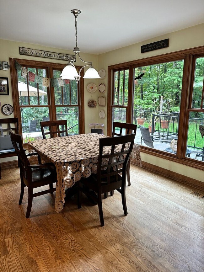 Building Photo - Dream Home in Highland, Michigan: Your Private Oasis on 5 Wooded Acres