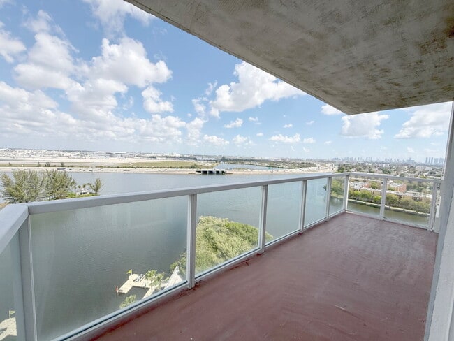 Building Photo - Rare 2/2 Corner Penthouse with Panoramic Lagoon Views from Every Room – Available Now!