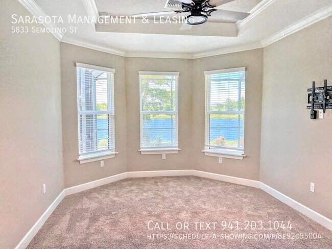 Building Photo - 2 Bed 2 Bath with Den Lake View Pool Home ...