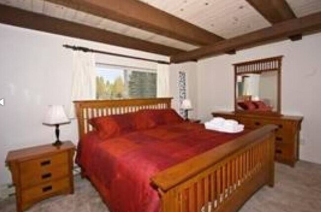 Building Photo - Unique open design,wood beams in all rooms-Very cheery and cozy. Newly remodeled, and newly furni...