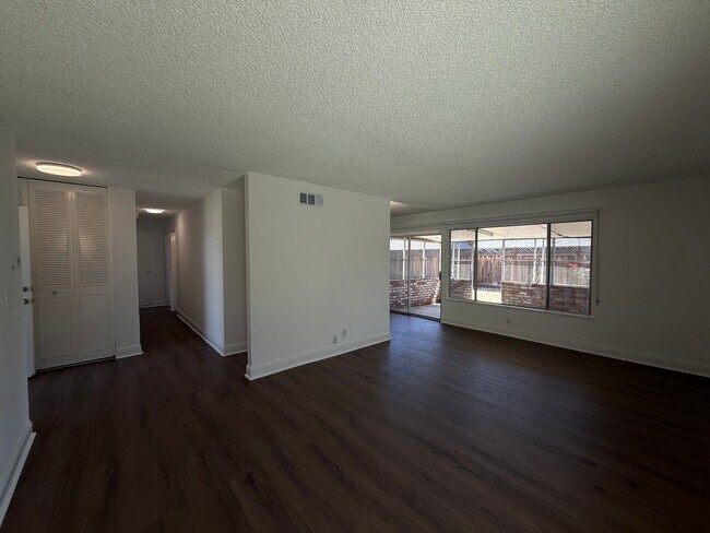 Building Photo - Recently updated home with new floors, paint & bathroom!