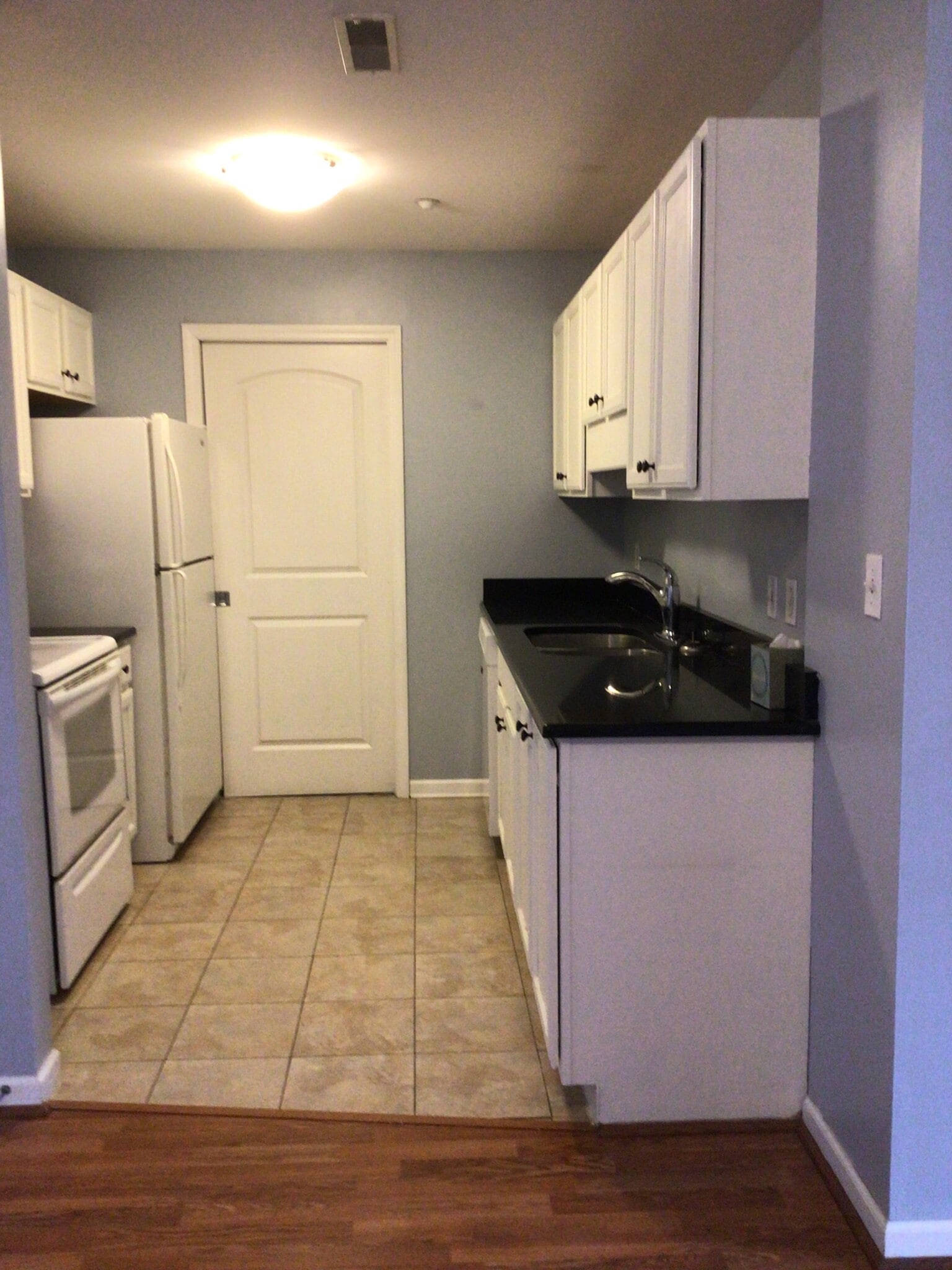 Kitchen with in unit laundry - 1117 University Ave