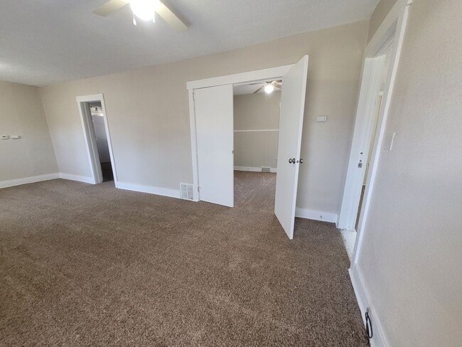 Building Photo - Four bedroom home on Indianola Ave with large yard and two decks!