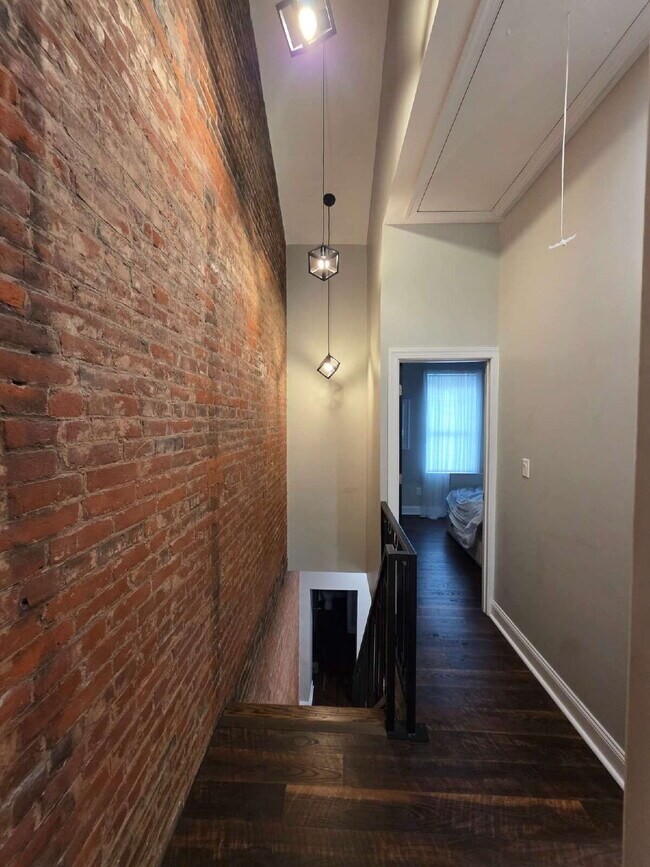 Building Photo - Chic Urban Living: Furnished 2-Bed Townhouse with Finished Basement in Pittsburgh's Strip District!