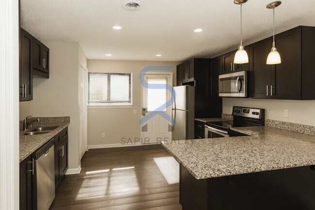 Building Photo - Move in before December 31st and choose your reward: a $250 Amazon Gift Card or a 55" Smart TV!