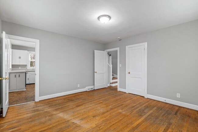 Building Photo - Brick home, Two Story, Hardwoods, DR, 2 Sun Rooms, FP, Carport!.