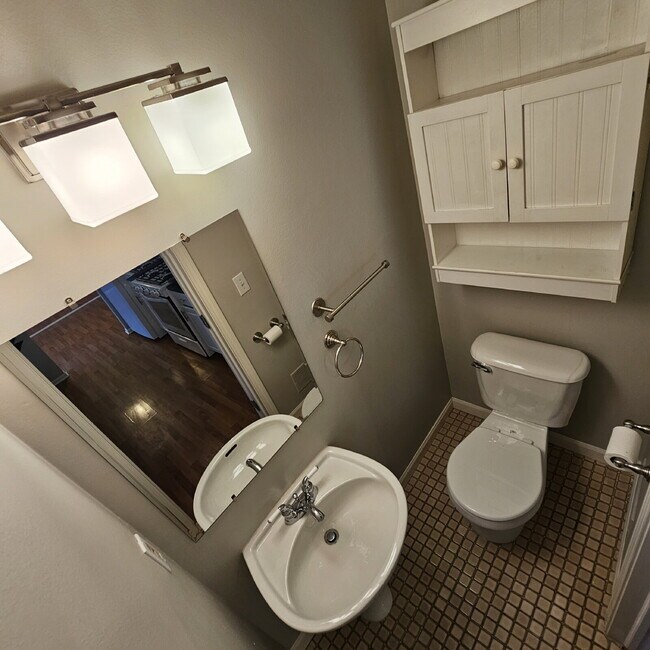 Building Photo - 2 Bedroom, 1.5 Bath Townhouse with Galley Kitchen & All Appliances, Open Living Area, Finished Ba...