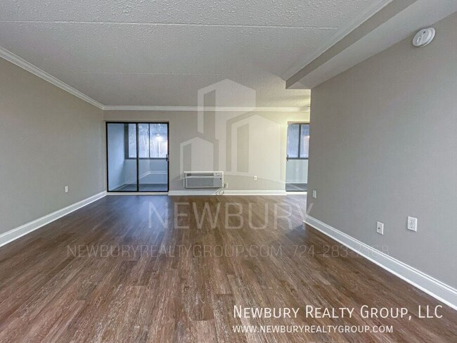 Building Photo - Luxury 1-Bedroom Penthouse with Modern Ren...