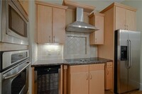 Building Photo - Penthouse Condo with Garage – Prime Location!