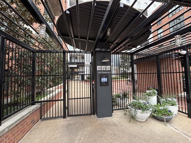 Building entrance with call box - 3110 Thomas Ave