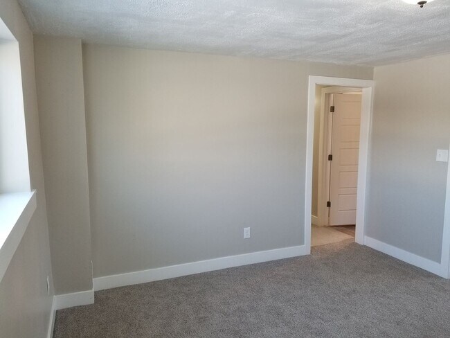 Building Photo - Spacious 5-Bedroom Magna Home with Deck and Ample Parking